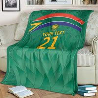 Green cricket blanket with flag stripes, Proteas crest, and 'YOUR TEXT 21' center print.