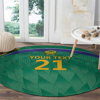 Green round cricket carpet with purple border and gold '21' marking
