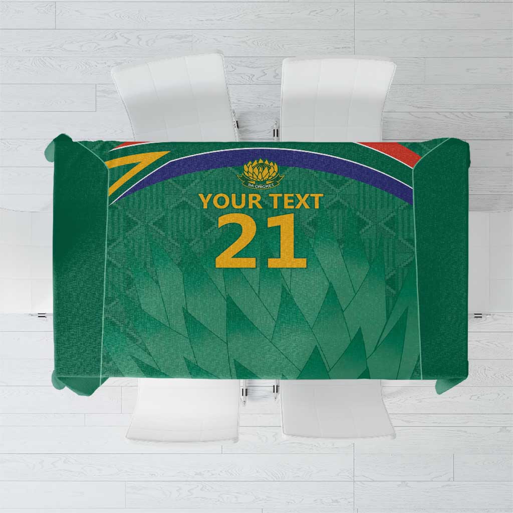 Green cricket tablecloth with Proteas emblem and large “21” graphic center