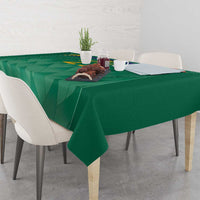 Green cricket tablecloth with geometric motif and crest-style emblem at center