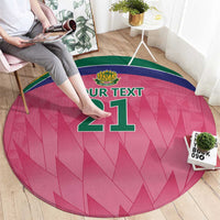 Pink round carpet with green border and '21' graphic on the floor