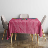 Pink cricket tablecloth on dining table with geometric pattern