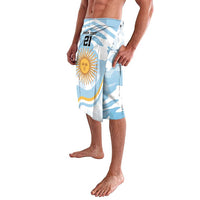 Blue and white patterned athletic shorts with sun emblem and number graphic