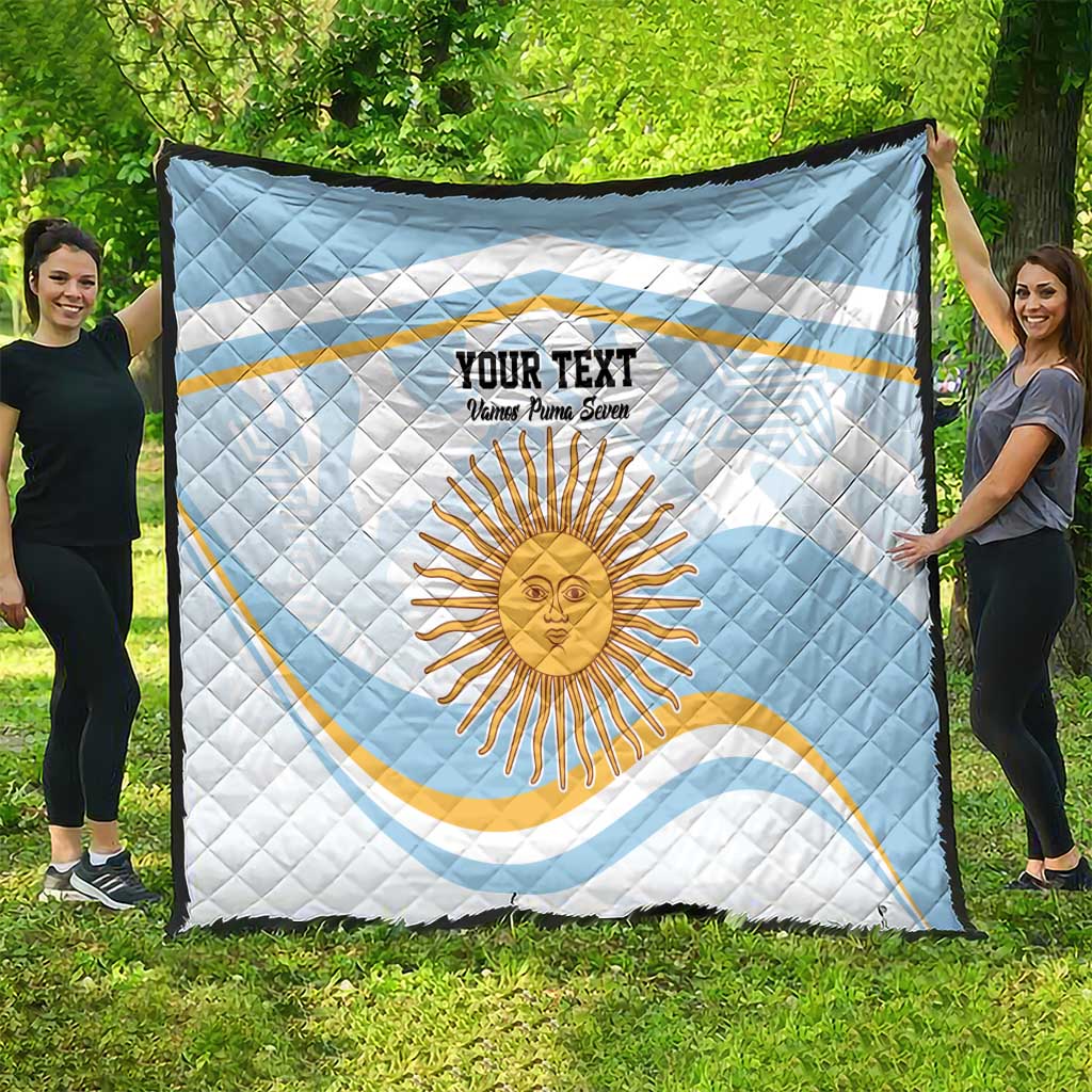 Light blue quilt with white backing, Argentina sun face and custom text centerpiece