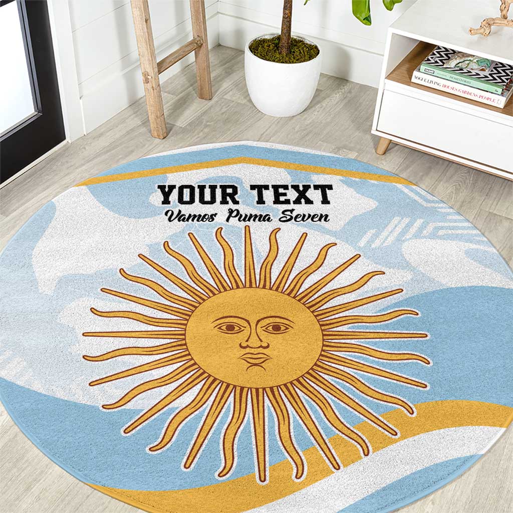 Blue round area rug with central sun face graphic and 'Your Text' custom line.