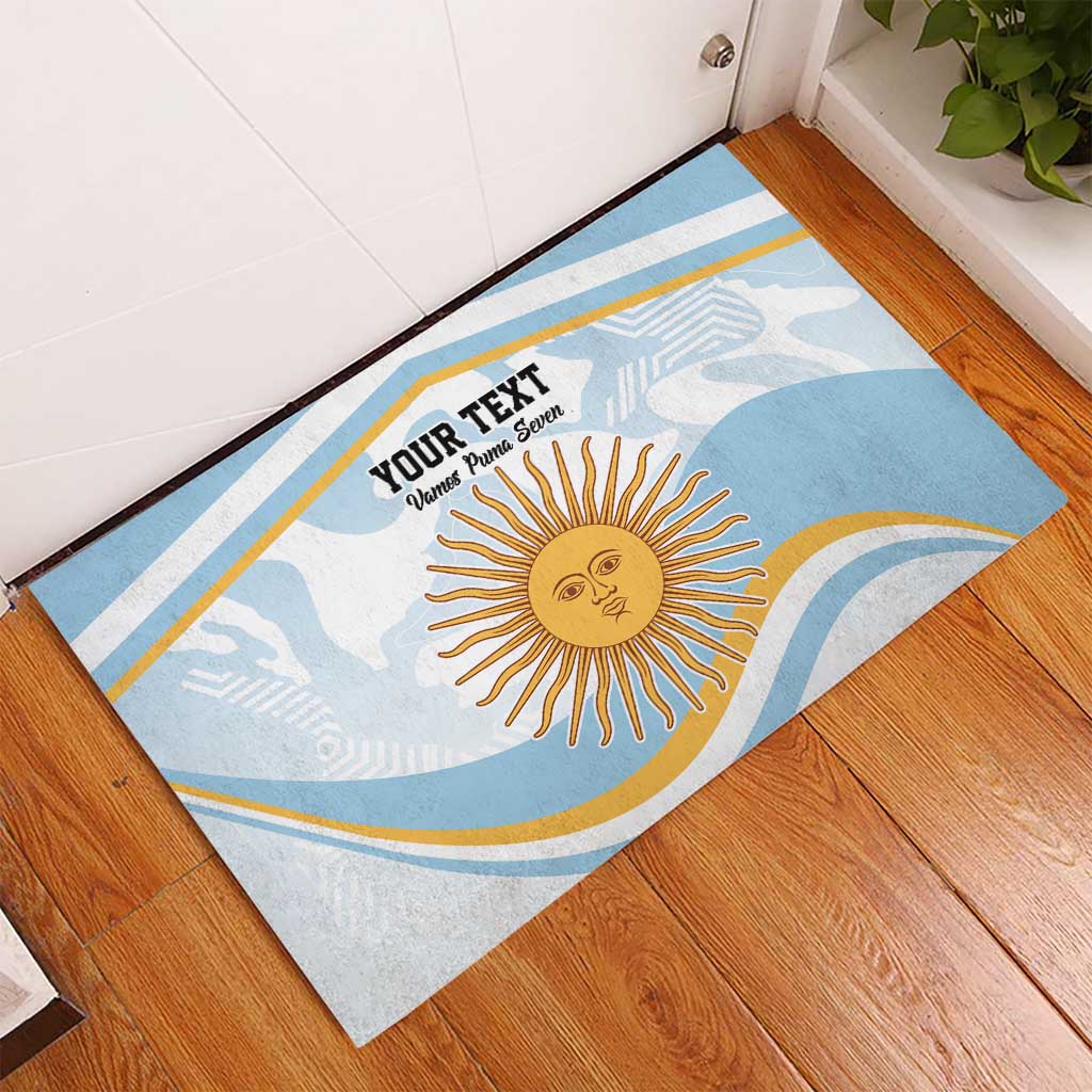 Blue custom doormat with sun emblem and custom text, laid at doorway