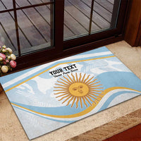 Blue custom doormat with sun graphic and custom text, on outdoor step