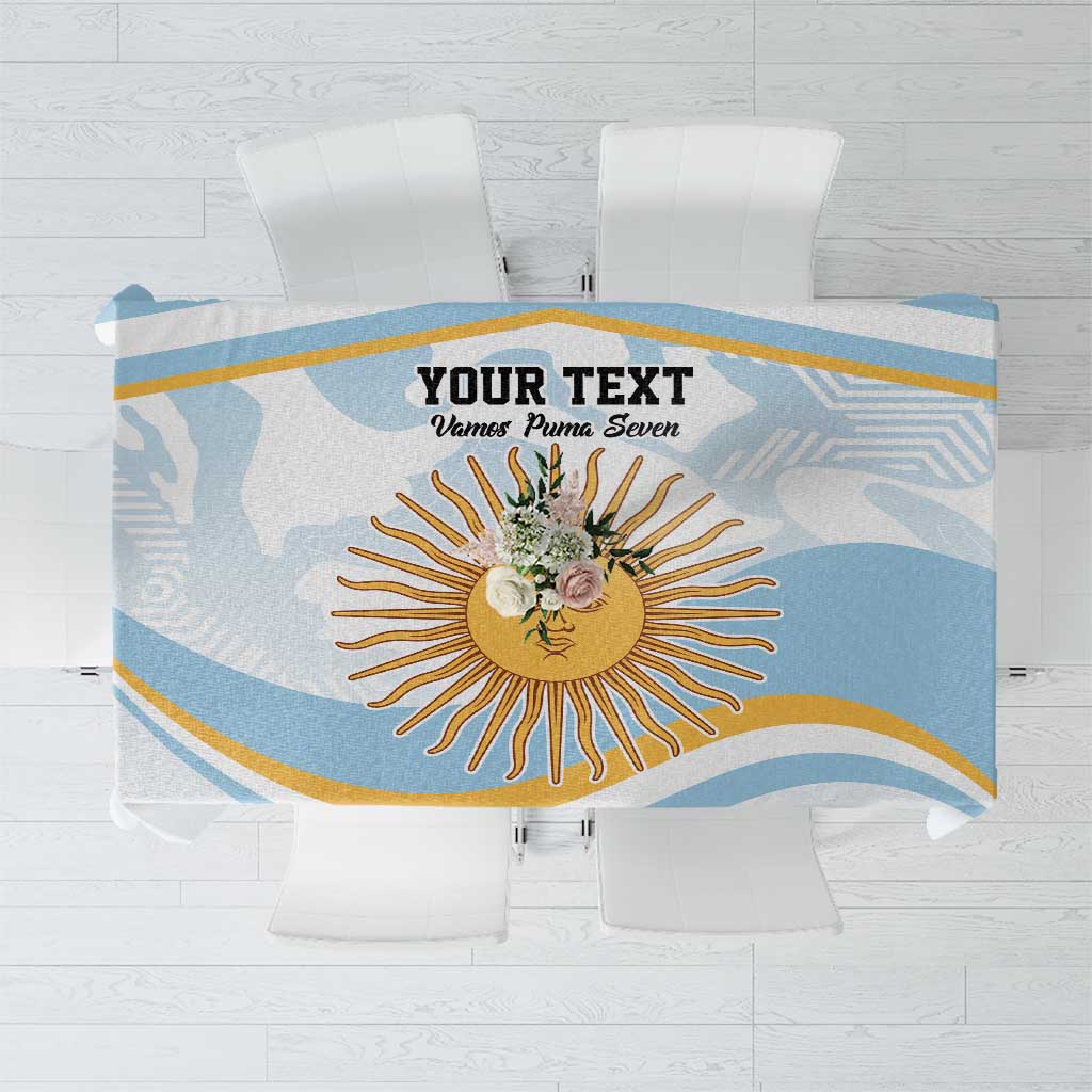 Light blue and white tablecloth with gold and navy sunburst design across center
