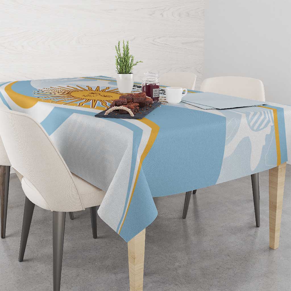 Light blue tablecloth with white and gold edge accents on a dining table