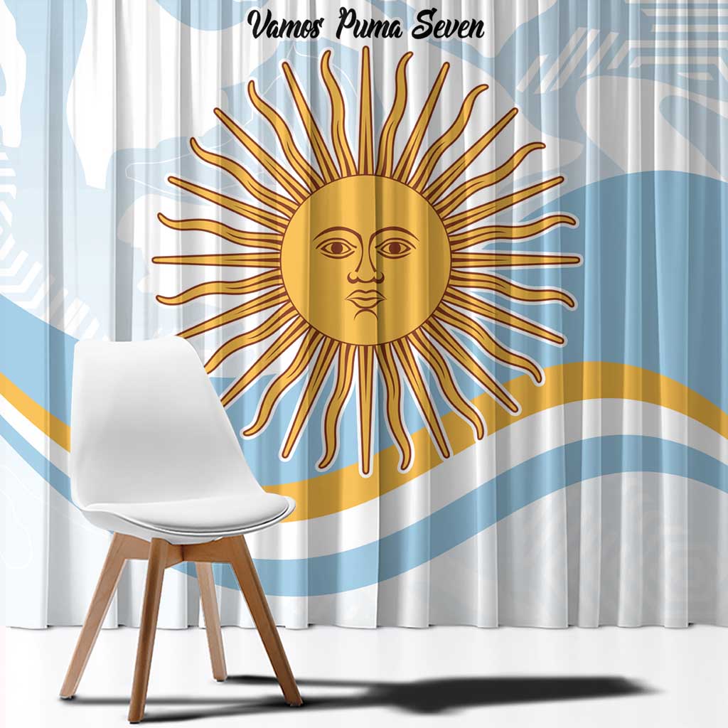 Close-up view of blue-and-white curtain with large gold sun face graphic and text