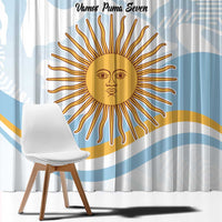 Close-up view of blue-and-white curtain with large gold sun face graphic and text