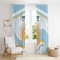 Blue window curtain panels with diagonal bands and central sun face print