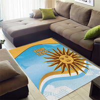 Rectangular blue area rug featuring a golden sun face graphic and custom text