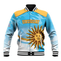 Unisex light blue baseball jacket with yellow shoulders, Uruguay text, sun emblem, striped rib trim