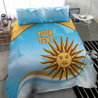 Blue duvet cover set with yellow sun logo, custom text, gold accent stripe and pillows