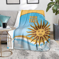 Blue and gold rugby blanket with 'YOUR TEXT' sun print draped over a chair