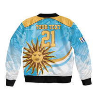 Light blue bomber jacket back with 'YOUR TEXT 21', sun graphic, black ribbed hem, sleeve patch