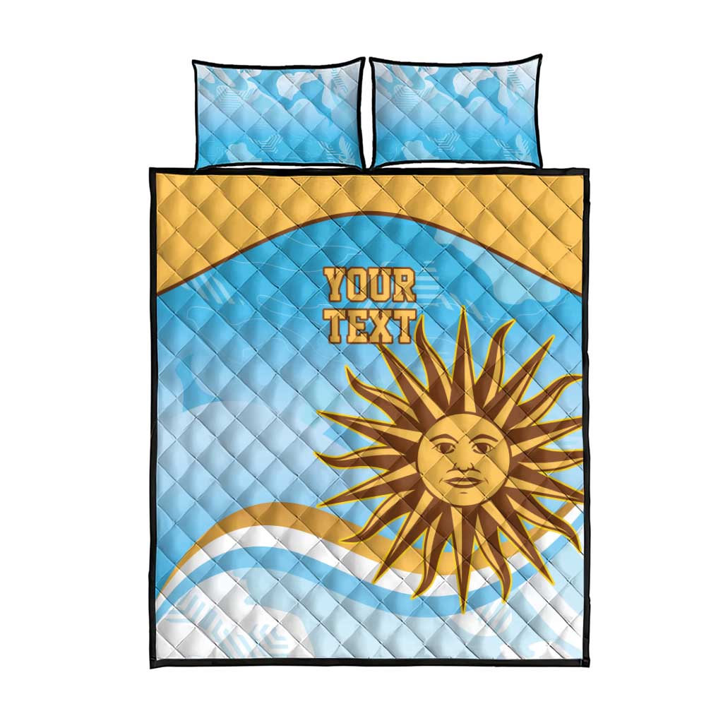 Blue quilt bed set showing 'YOUR TEXT' and yellow sun graphic, with two matching pillows