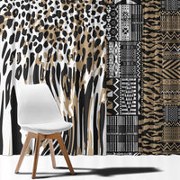 Leopard-pattern window curtain panel beside a tribal geometric patterned panel in beige and black.