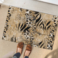Beige rubber entry doormat with zebra stripes and leopard spots, full view
