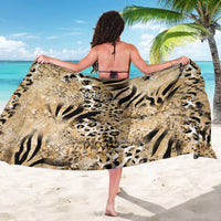 Beige animal-print sarong with bold black zebra and leopard motifs, worn draped