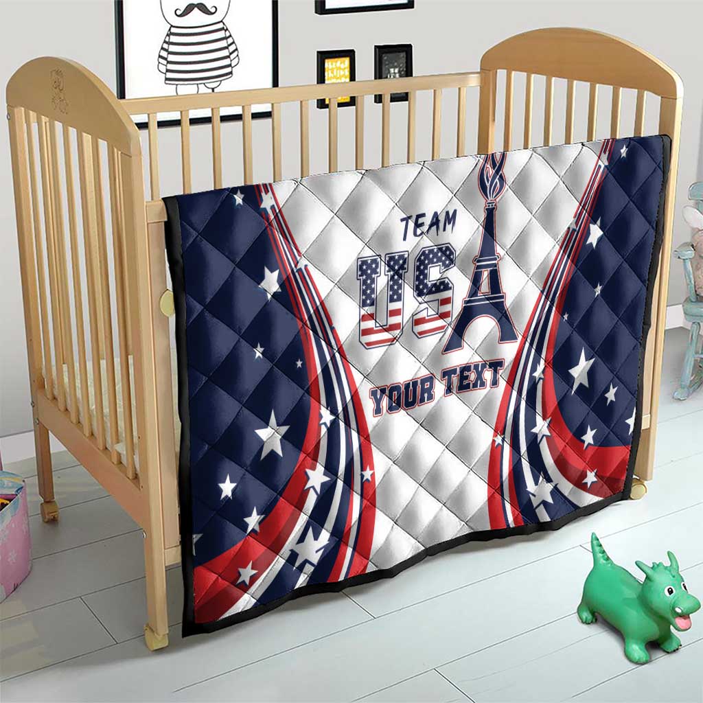 Personalized USA quilt on crib with navy star border, “TEAM USA” emblem and “YOUR TEXT”