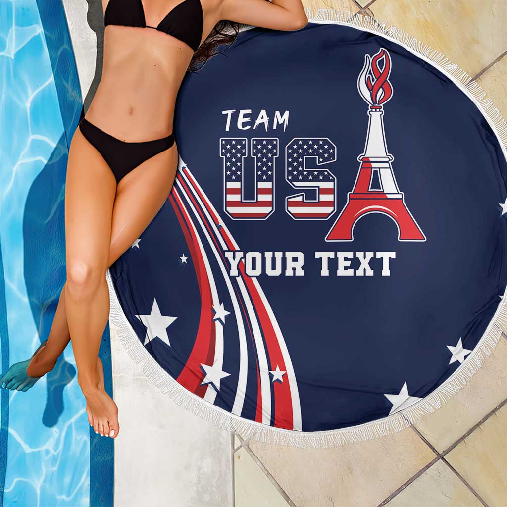 Round blue beach blanket with USA flag and Team US design, white fringe edge.