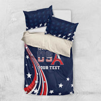 Blue comforter with Team USA design and matching star pillows on a light surface