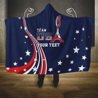 Blue hooded blanket draped on floor, with team emblem, stars and stripes