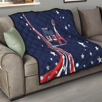 Navy quilt draped over sofa with stars and red-white flag ribbon graphic, “TEAM USA”