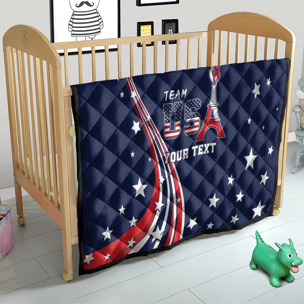 Navy quilt on a wooden crib with stars and US flag ribbon graphic, “TEAM USA” and “YOUR TEXT”