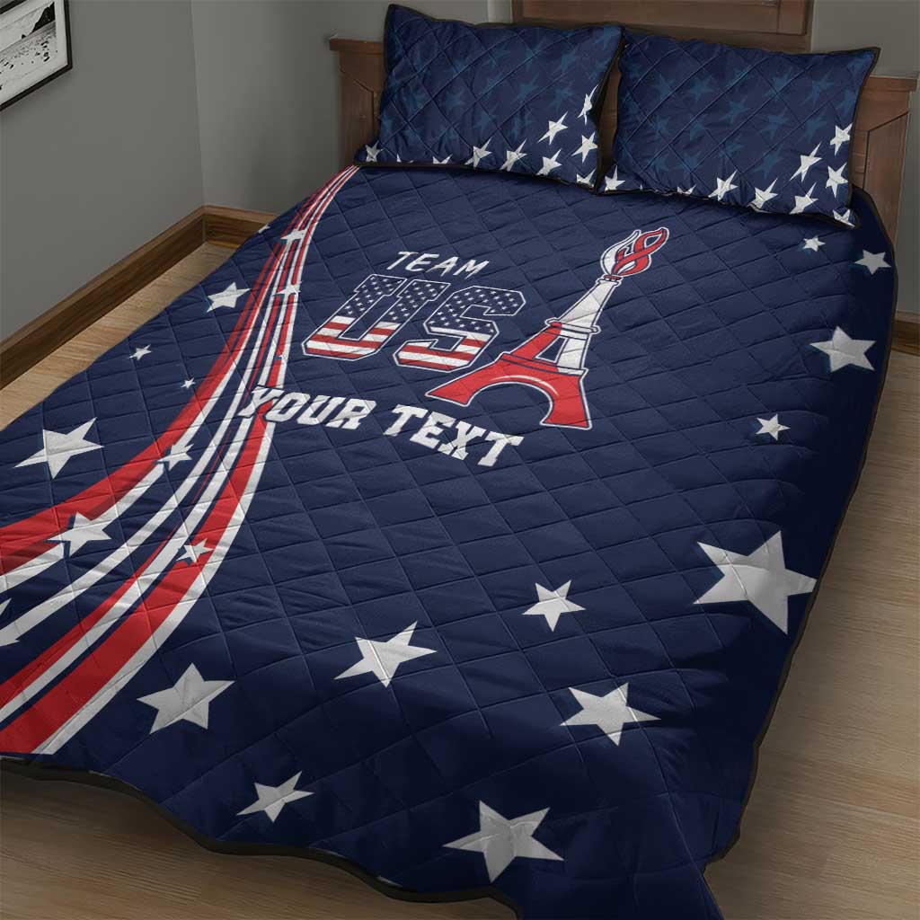 Blue quilt bed set on bed with Team USA Eiffel design and scattered white stars