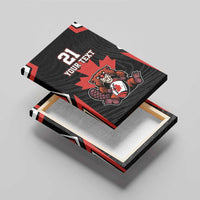 Black canvas wall art with red maple leaf and beaver mascot, front and backing shown