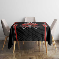 Black tablecloth with red-trim border and rugby-style crest in center
