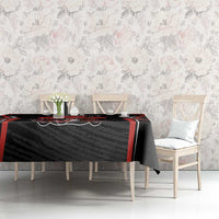 Black tablecloth featuring red border and rugby crest, beaver and maple leaf theme