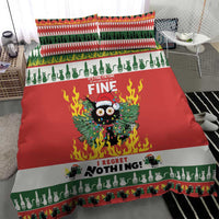Christmas bedding set on bed: red center panel with owl in flames, green border and stripes