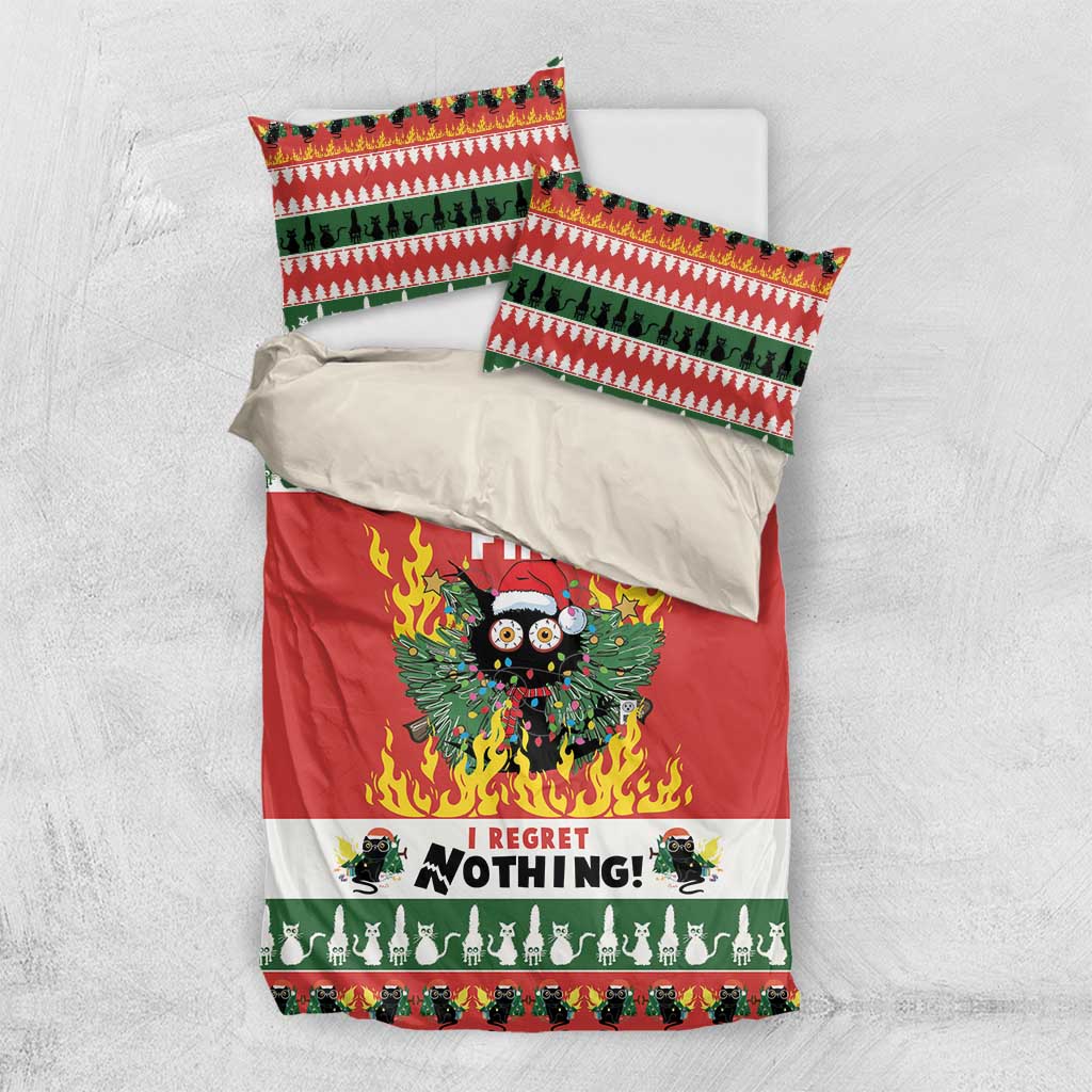 Christmas bedding set flat lay: red duvet with flaming owl graphic and green patterned pillowcases