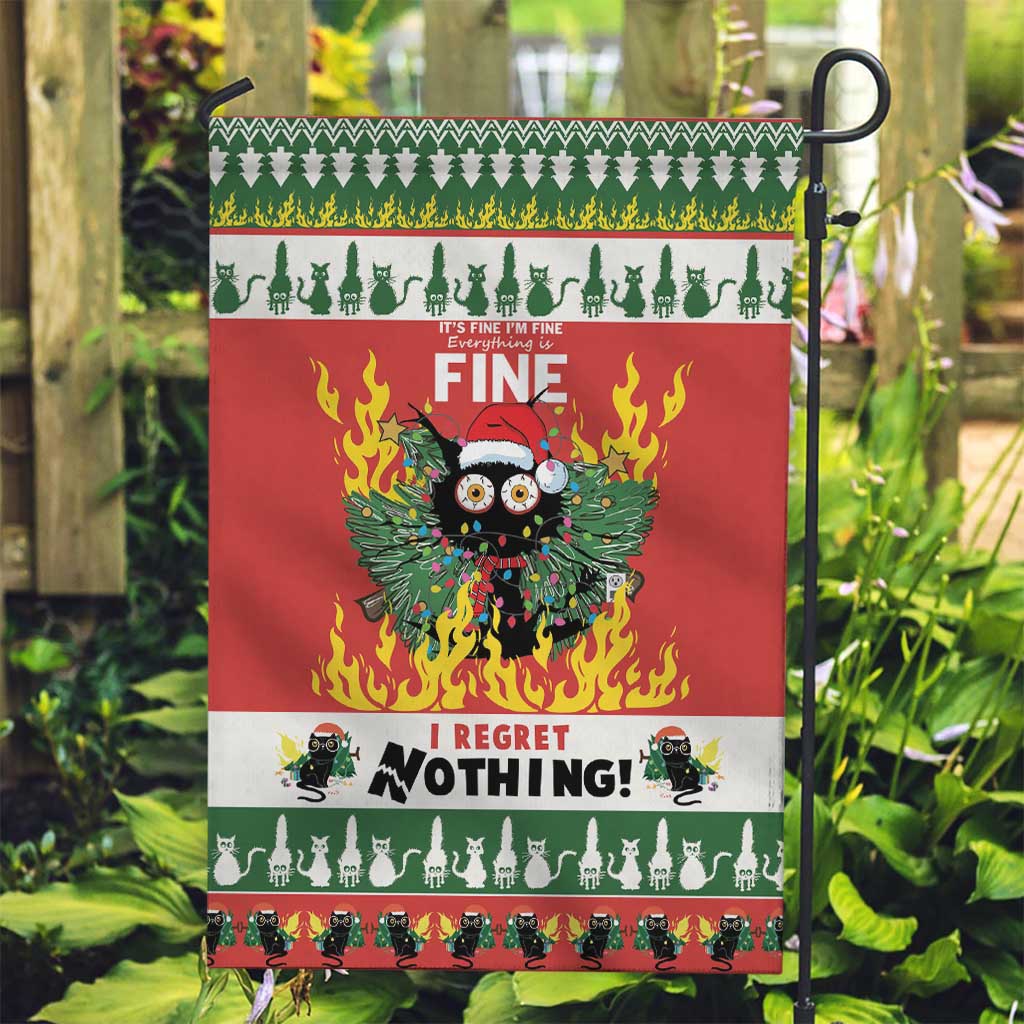 Red garden flag on pole with green trim and cat-in-flames graphic, “FINE” and “I REGRET NOTHING!”