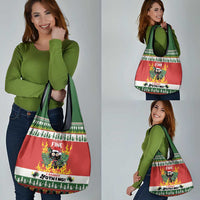 Person holding a red Christmas grocery tote bag with cat graphic and green handles