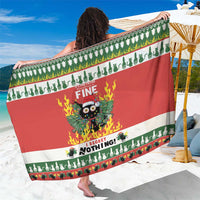 Red and green striped Christmas sarong with cat, flames, and “Fine” graphic.