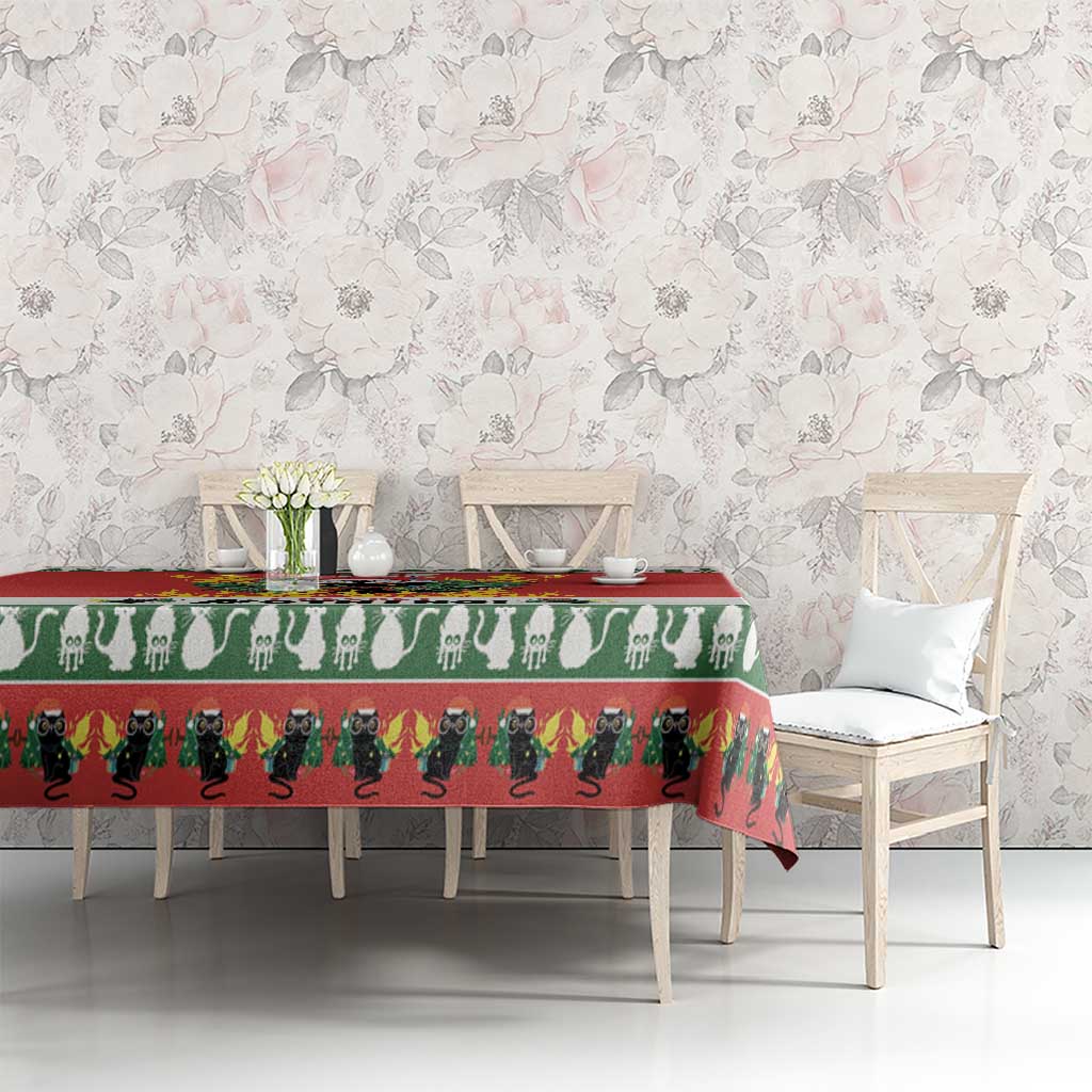 Christmas cat tablecloth, red and green, on rectangular table with cat silhouette band