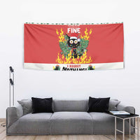 Red Christmas wall tapestry with flaming cat graphic above gray sofa