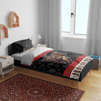 Black bed set with Krampus devil comforter panel, red trim, and snowflake accents