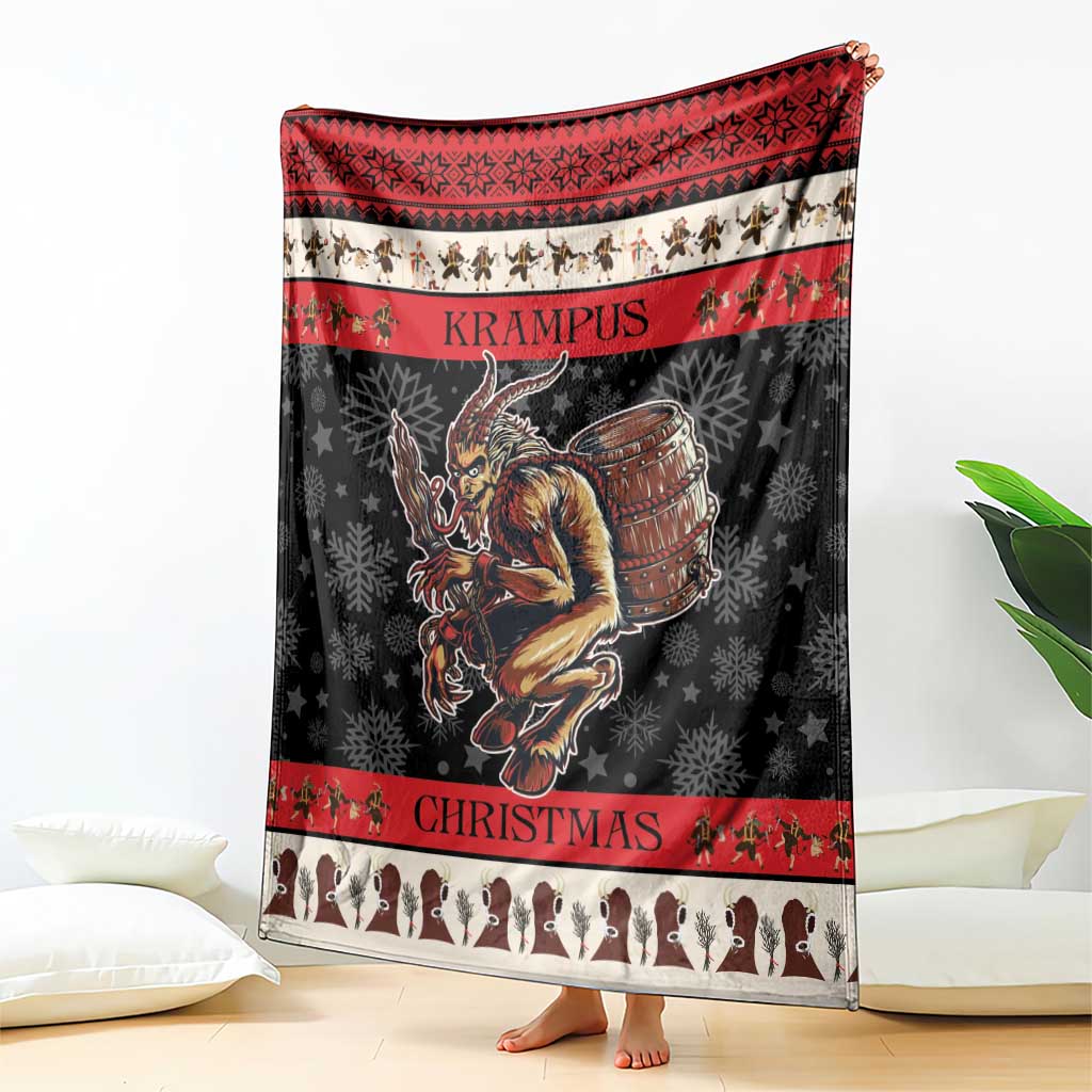 Krampus Christmas blanket shown folded on floor; black with red top stripe and demon illustration
