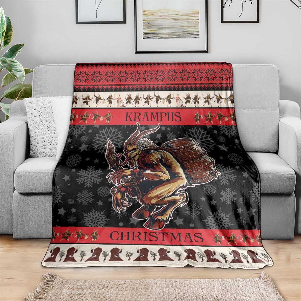 Red and black Krampus Christmas blanket with central demon illustration and striped borders