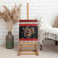 Krampus Christmas canvas wall art on easel, black with red stripes and devil barrel illustration