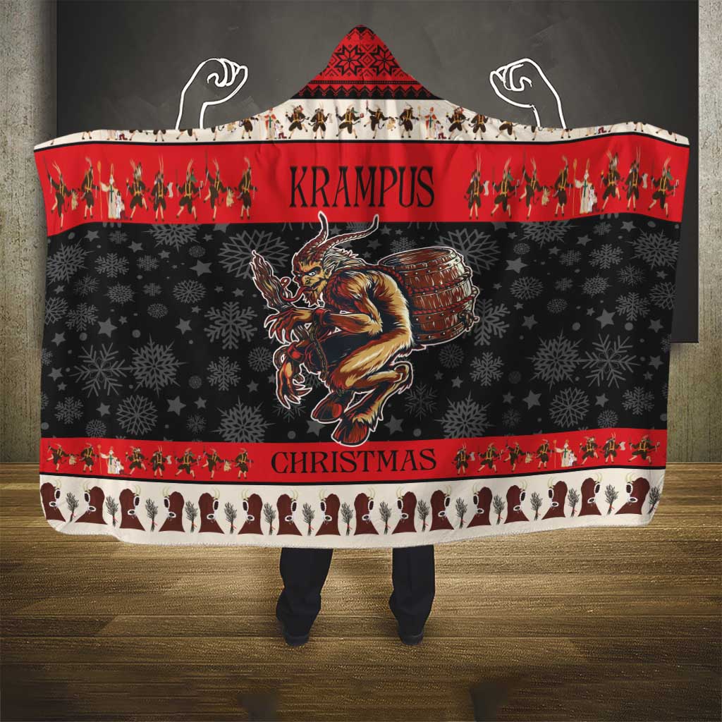 Red and black hooded Christmas blanket with devil drum graphic and striped border