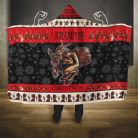 Red and black hooded Christmas blanket with devil drum graphic and striped border