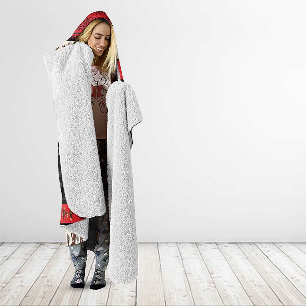 Sherpa-lined hooded blanket, red and black devil design, worn with hood up