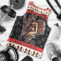 Men's black graphic tank top laid flat: Krampus devil with barrel, red “CHRISTMAS” band